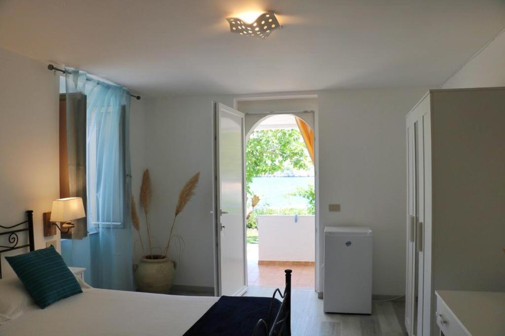 Uma cama ou camas num quarto em Albergo"Villa Biscotti"