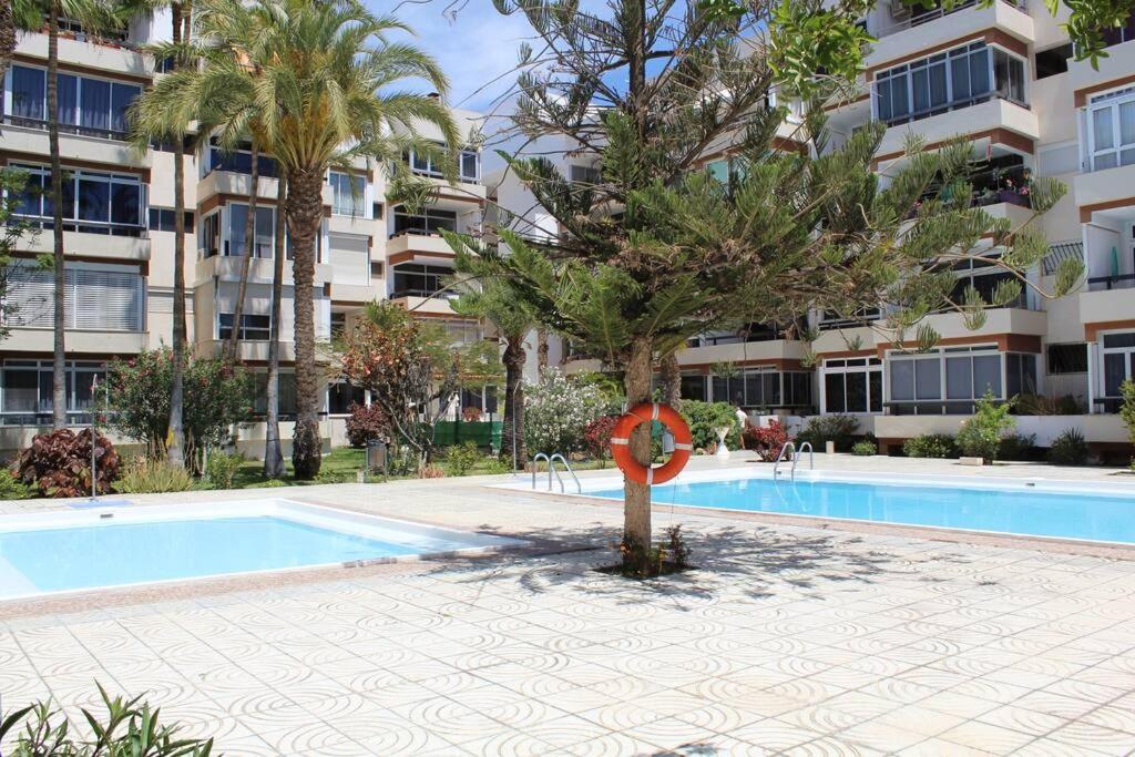 The swimming pool at or close to Acogedor Atlantis