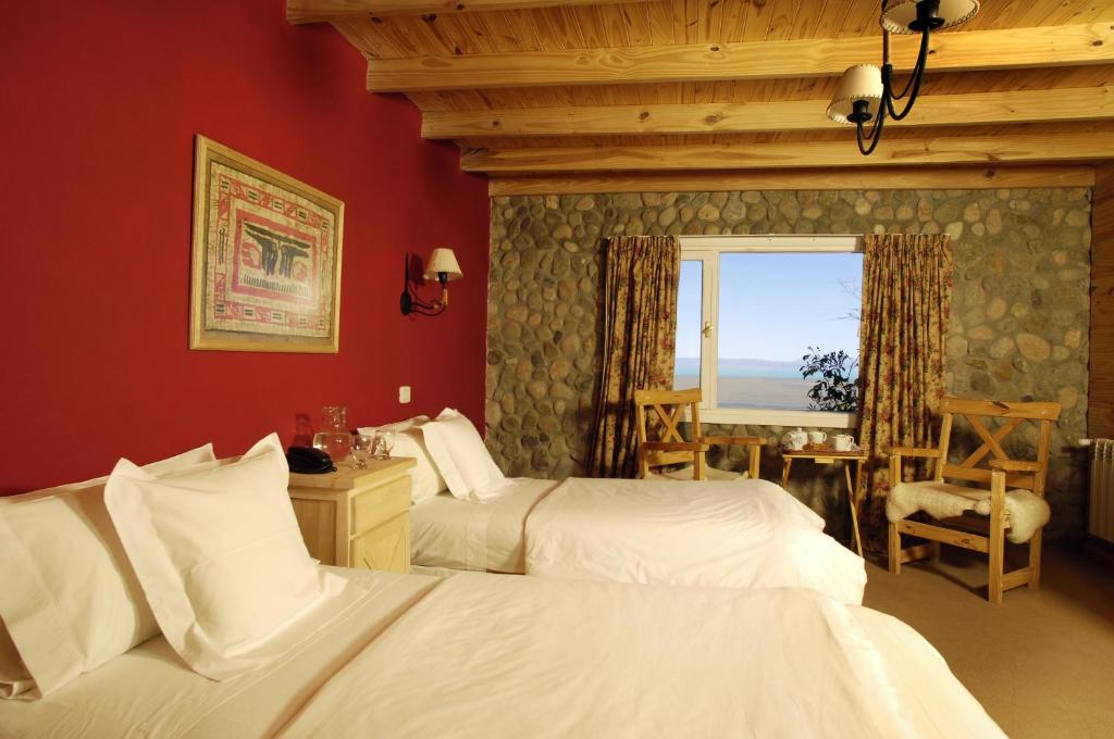 Cama ou camas em um quarto em Blanca Patagonia Hostería Boutique y Cabañas