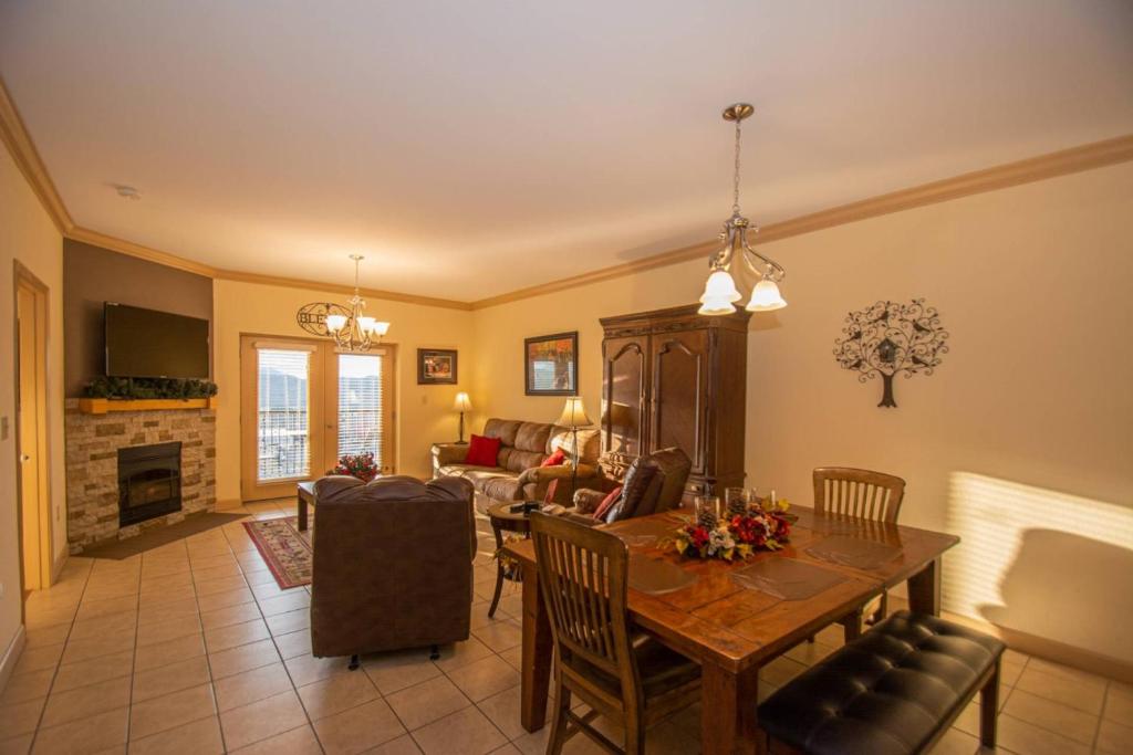 a living room with a dining room table and a couch at Simply Blessed Mountain View 1605 in Pigeon Forge