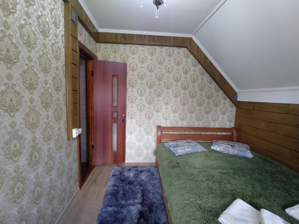 Postel nebo postele na pokoji v ubytování Чистий Спокій