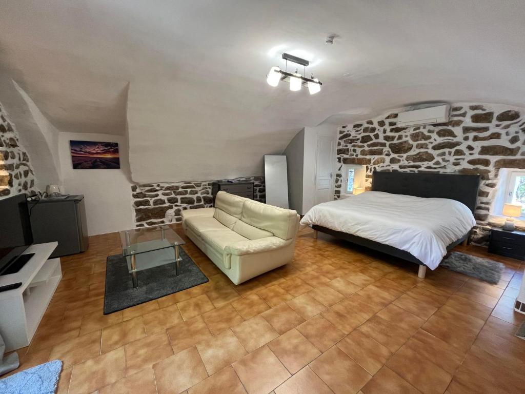 Postel nebo postele na pokoji v ubytování Hôtel Mas de l'Espaïre