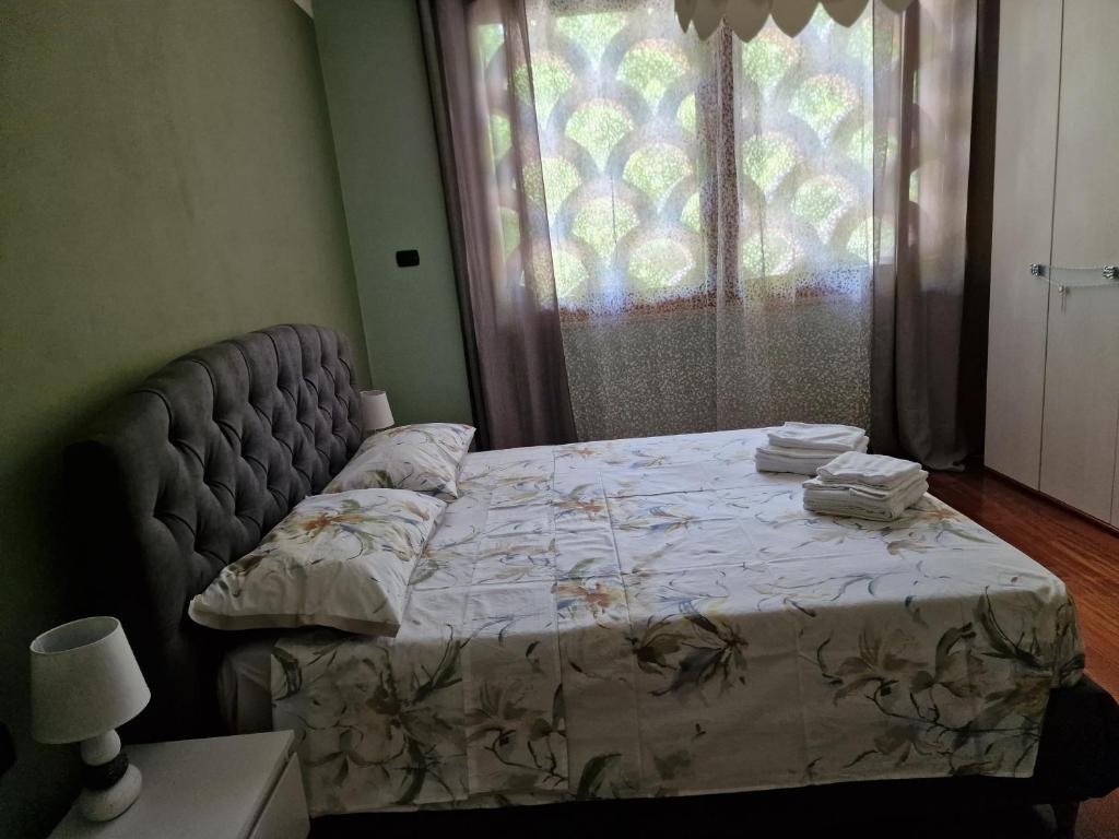 Łóżko lub łóżka w pokoju w obiekcie "Cortela" appartameni in villetta singola