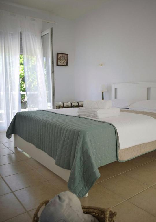 Postel nebo postele na pokoji v ubytování Lemon House