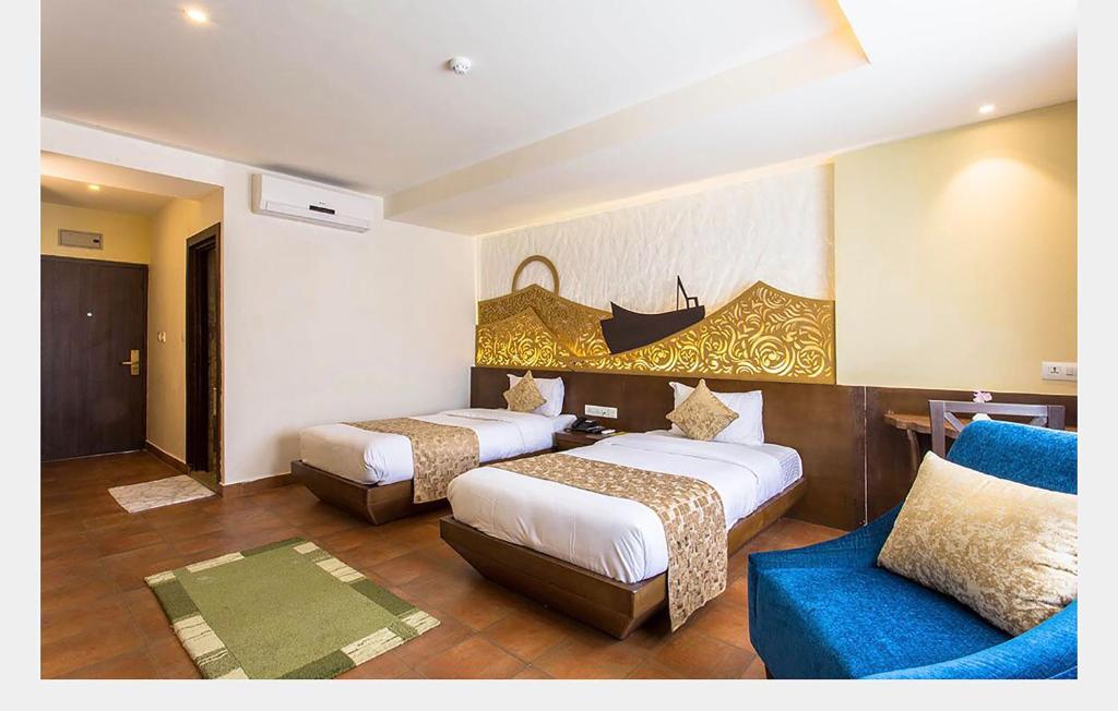 Llit o llits en una habitació de Teeka Resort Suites & Spa