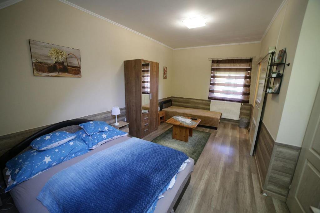 Postel nebo postele na pokoji v ubytování Fónagy Apartmanok