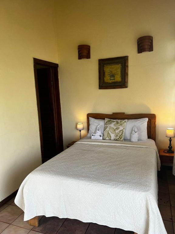 Postel nebo postele na pokoji v ubytování Hotel La Colina