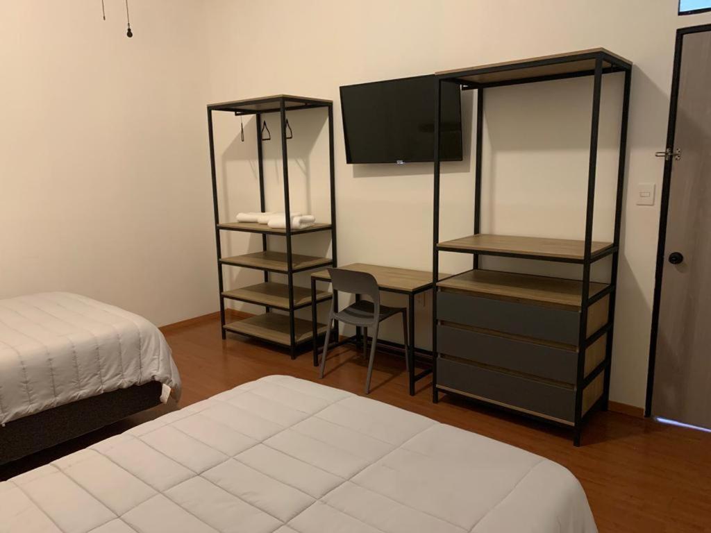 Postel nebo postele na pokoji v ubytování Hostal 170