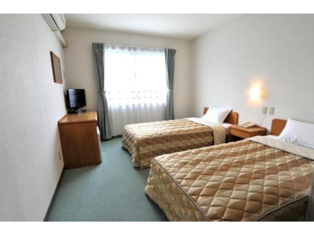 Postel nebo postele na pokoji v ubytování Hotel Yamadaso - Vacation STAY 10202v