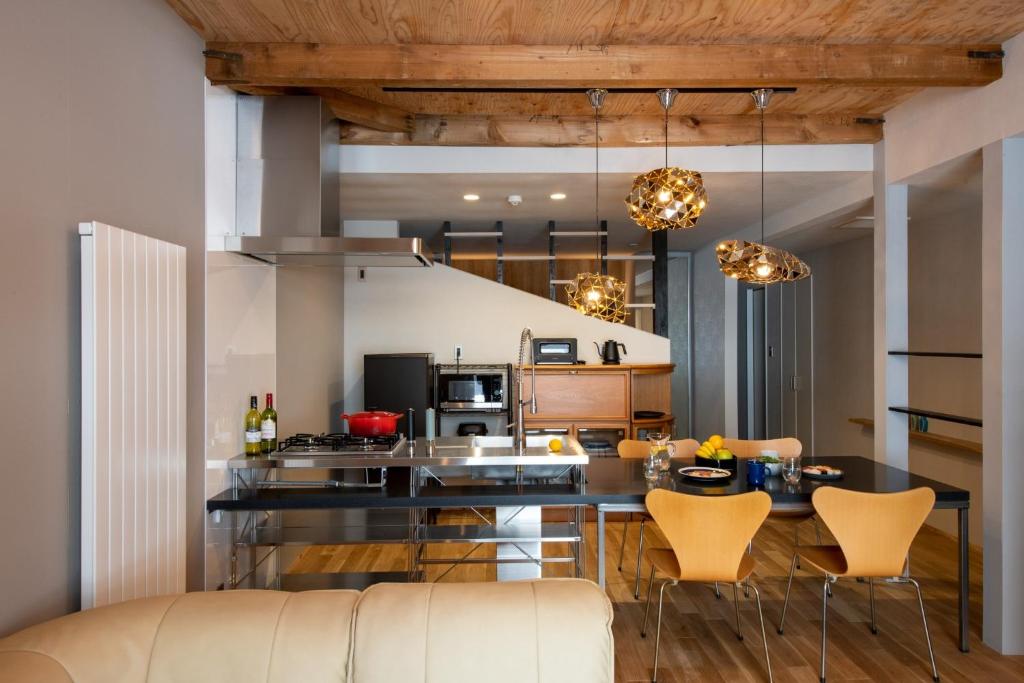 a kitchen and living room with a table and chairs at Abuta-gun - House - Vacation STAY 14526 in Kutchan
