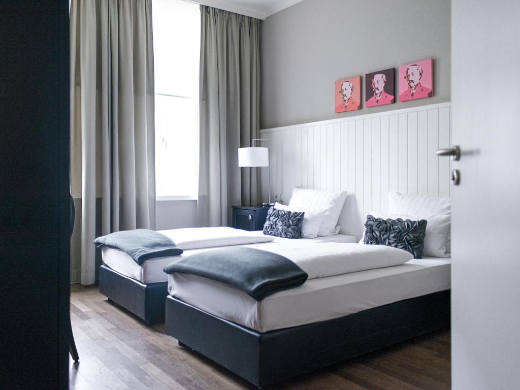 Cama ou camas em um quarto em Hotel Victoria
