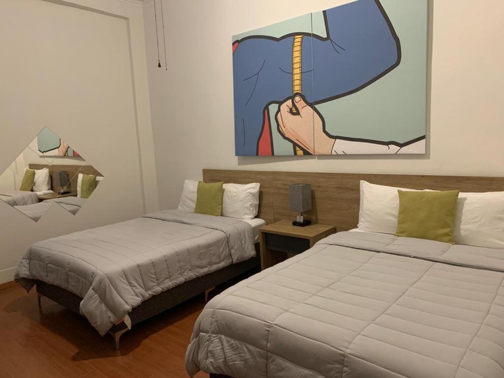 Postel nebo postele na pokoji v ubytování Hostal 170
