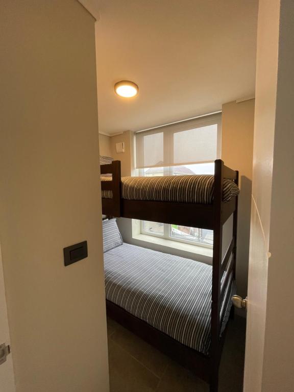 Postel nebo postele na pokoji v ubytování Epicentro Suites Apart Hotel - Valdivia
