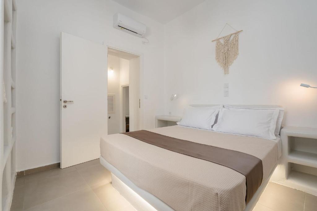 Postel nebo postele na pokoji v ubytování Bee Naxian House