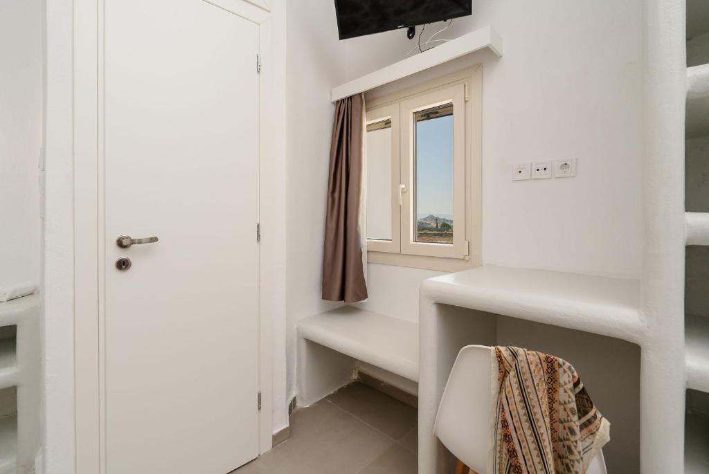 Postel nebo postele na pokoji v ubytování Bee Naxian House