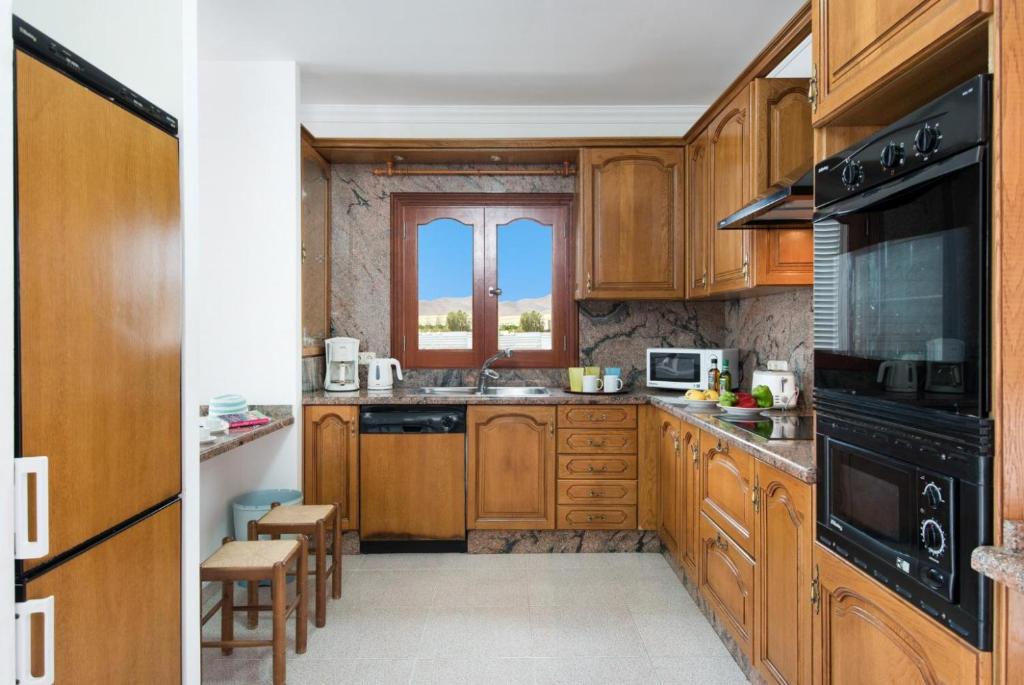 Kuchyň nebo kuchyňský kout v ubytování Villa Ramos Dos