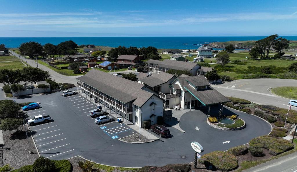 an aerial view of a building with a parking lot at Emerald Dolphin Inn & Mini Golf in Fort Bragg