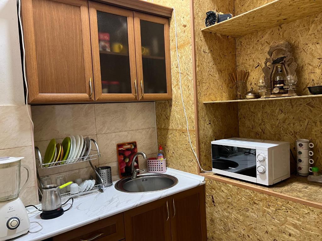 Kuchyň nebo kuchyňský kout v ubytování Arm Hotel
