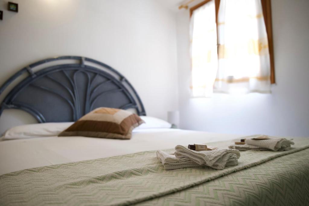 Posteľ alebo postele v izbe v ubytovaní Appartamento Casa Tonina