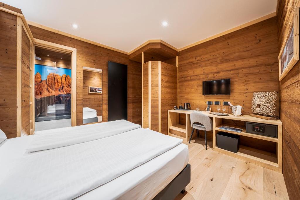 Кровать или кровати в номере Hotel Villa Alpina ***S