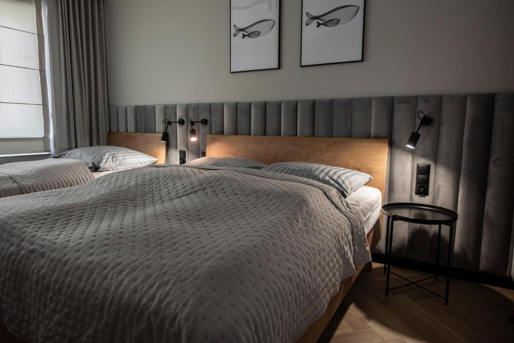 Postel nebo postele na pokoji v ubytování Lazur Apartamenty Domki