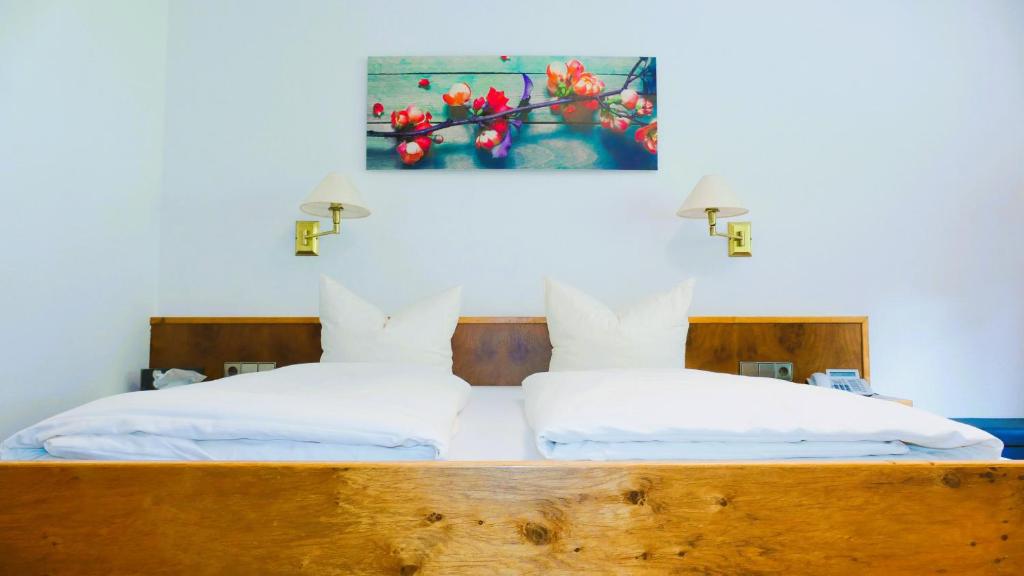 Postel nebo postele na pokoji v ubytování Hotel Sonne