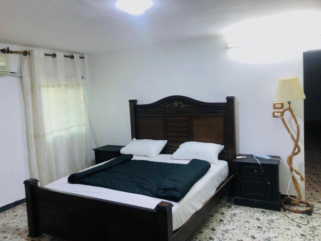 מיטה או מיטות בחדר ב-Bahaa