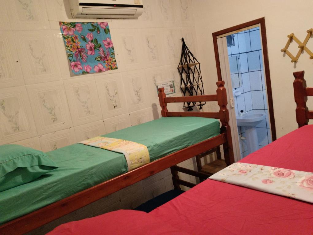 Postel nebo postele na pokoji v ubytování Jurema Hostel