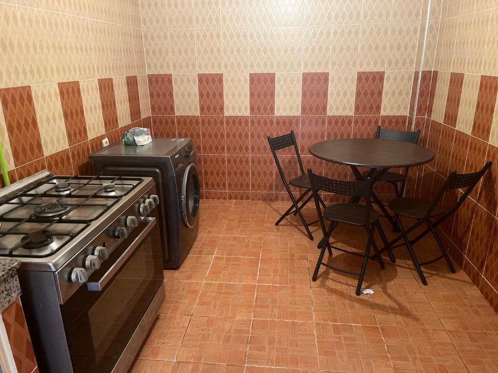 Kuchyň nebo kuchyňský kout v ubytování Residence Mly youssef appart
