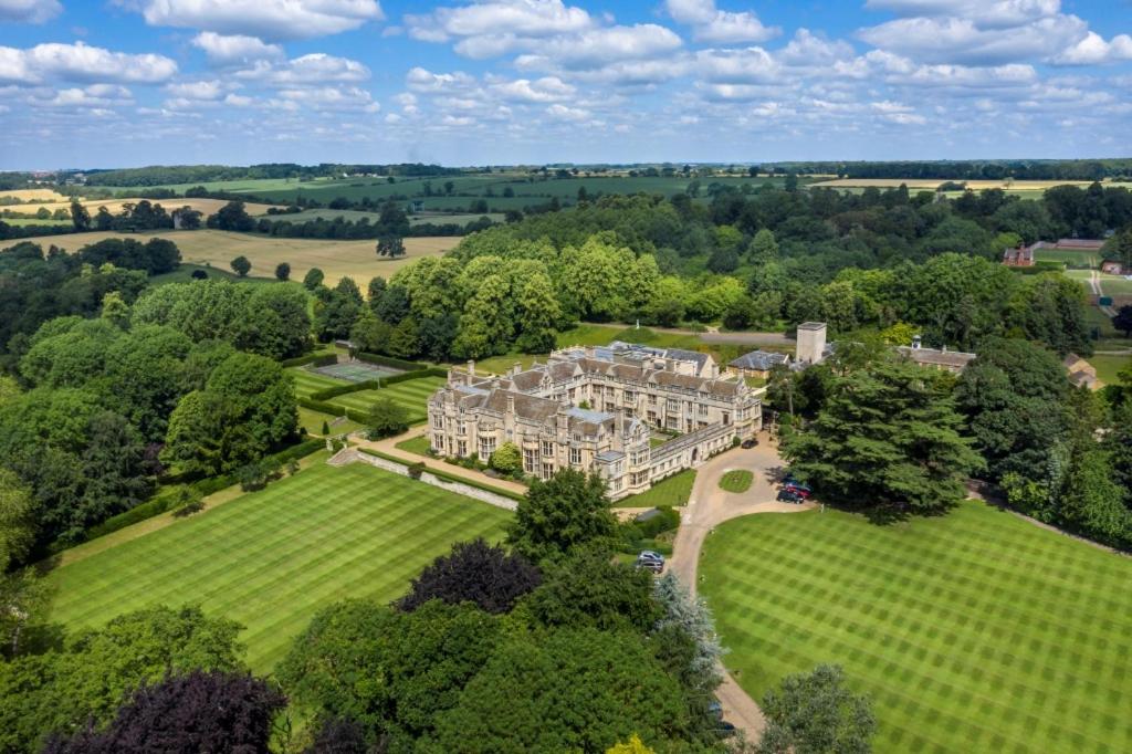 an aerial view of a large estate with trees at Rushton Hall Hotel and Spa in Kettering