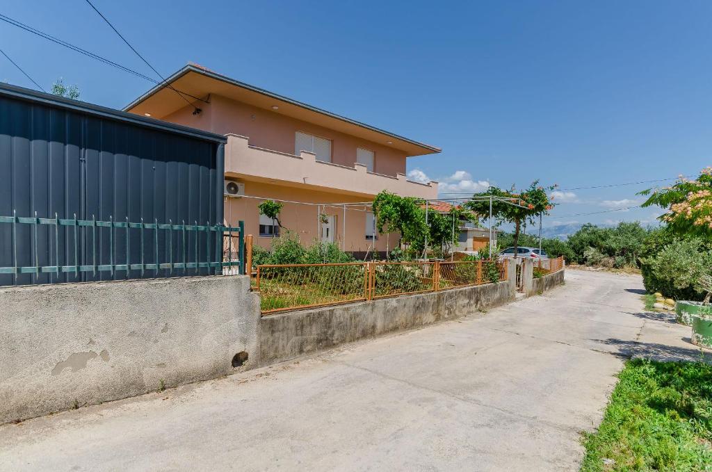 an empty street in front of a house at Apartment Skoko in Slatine