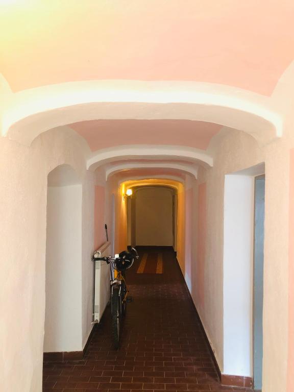 a bike parked in the hallway of a building at Holmes Café & Pension in Engelhartszell