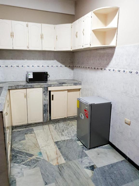 Kuchyň nebo kuchyňský kout v ubytování OCEANIk SUITES & HOTEL
