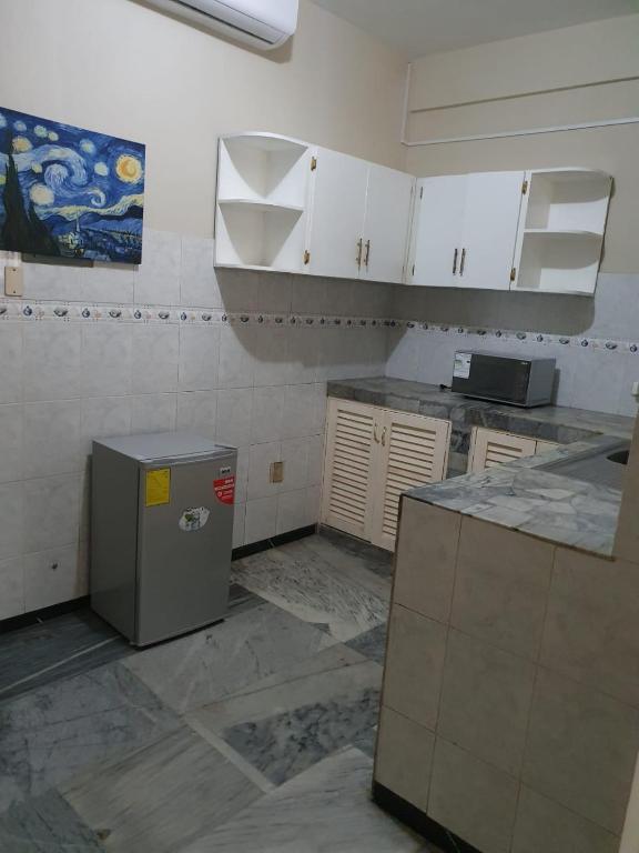 Kuchyň nebo kuchyňský kout v ubytování OCEANIk SUITES & HOTEL