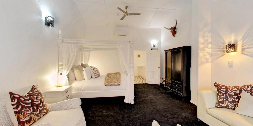 Postel nebo postele na pokoji v ubytování Orewa Beachcomber