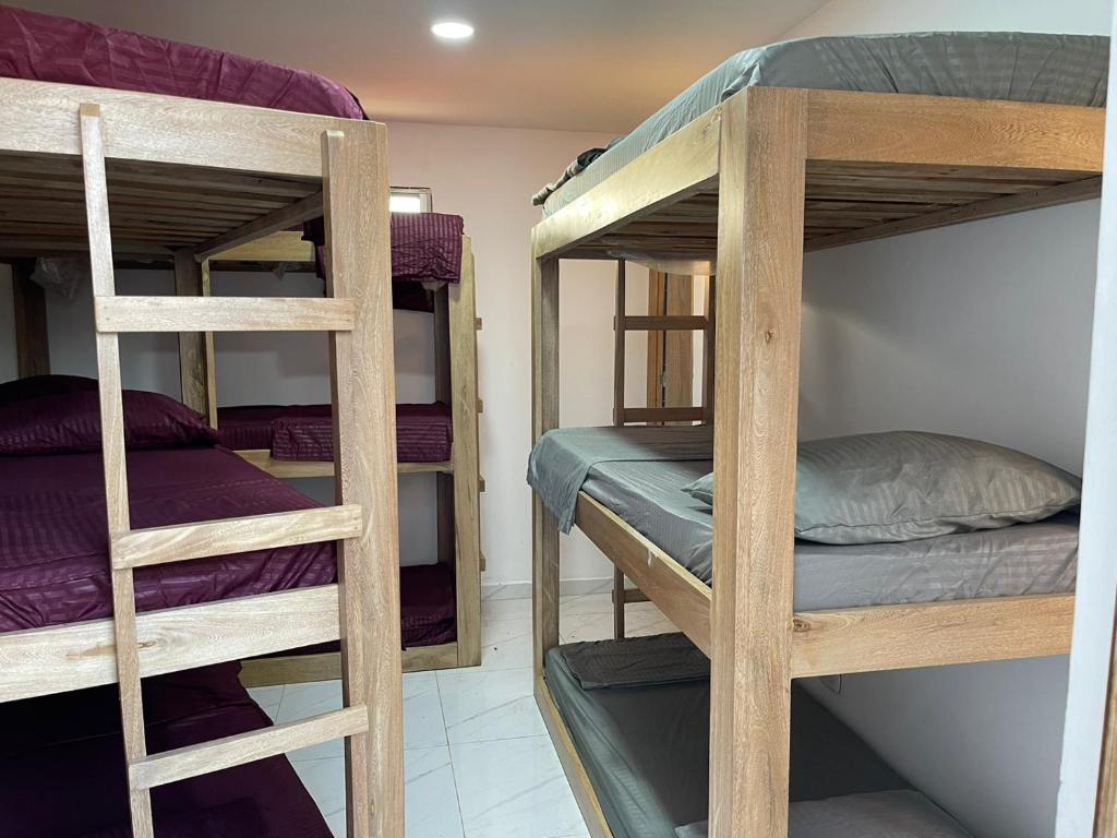 a room with three bunk beds in a room at Casa Finca La 58 Melina Real 