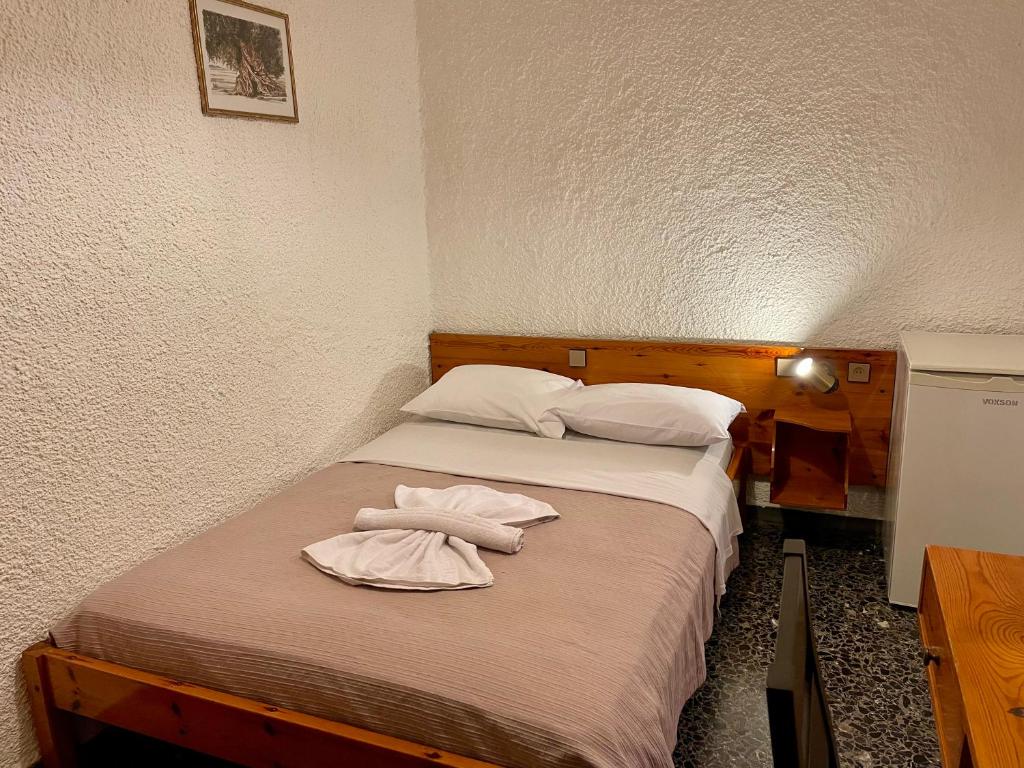 Postel nebo postele na pokoji v ubytování Lefka