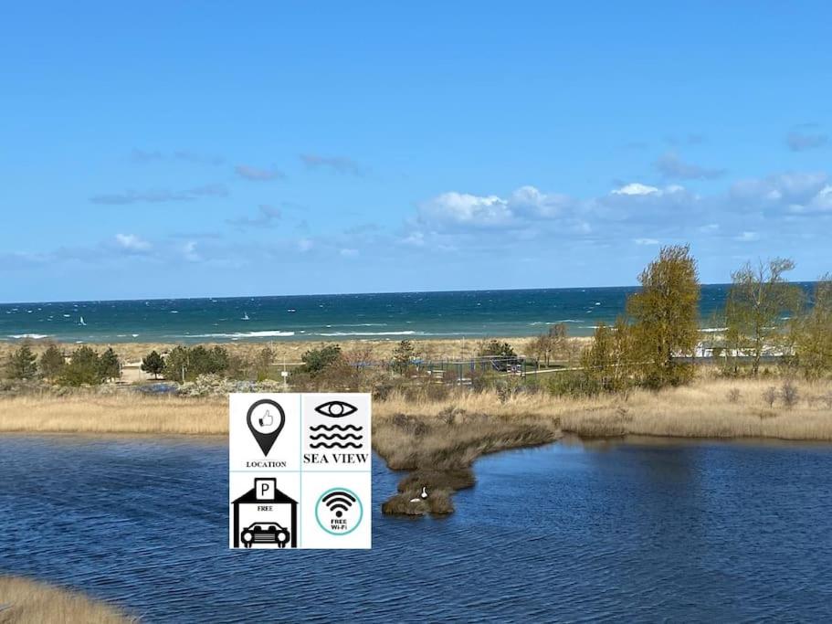 a sign in the middle of a body of water at Seaview, Beach, Sunsets, Nature in Heiligenhafen