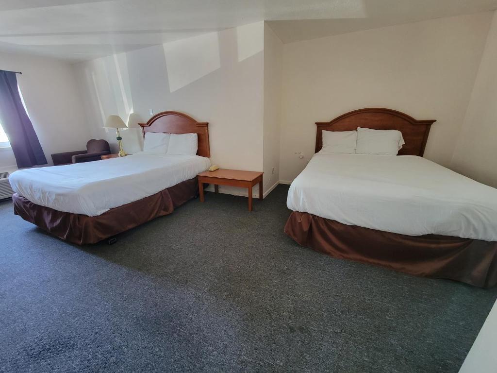 Postel nebo postele na pokoji v ubytování Stellar Motel
