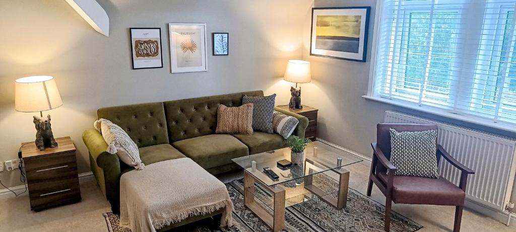 a living room with a couch and a table at Homebird Property - Rutland Apartment in Harrogate