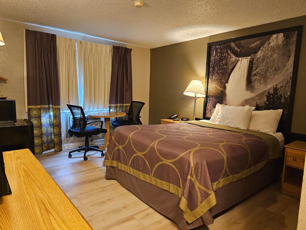 Postel nebo postele na pokoji v ubytování Wyo Inn