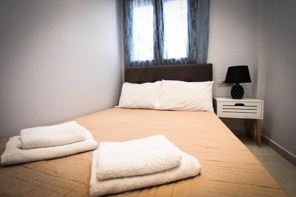 Postel nebo postele na pokoji v ubytování Nefeli Apartment