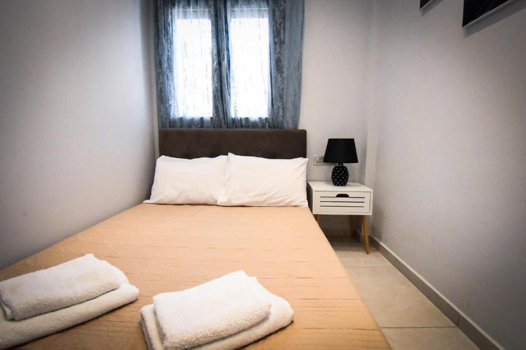 Postel nebo postele na pokoji v ubytování Nefeli Apartment