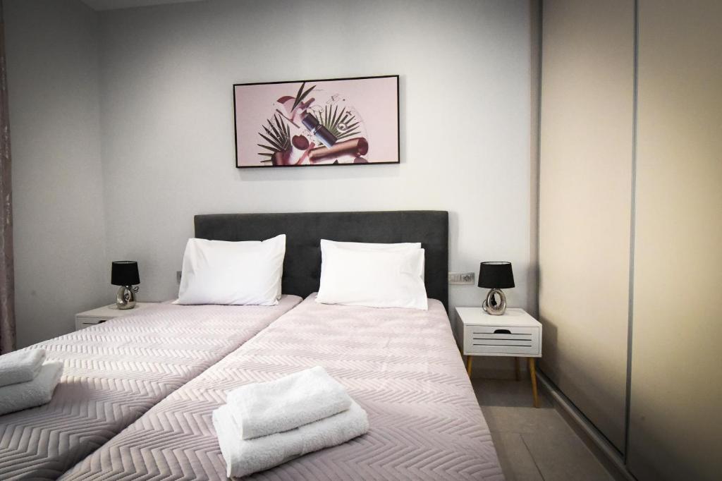 Postel nebo postele na pokoji v ubytování Nefeli Apartment