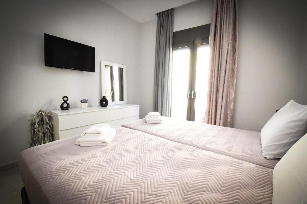 Postel nebo postele na pokoji v ubytování Nefeli Apartment