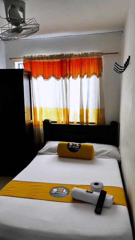 Postel nebo postele na pokoji v ubytování Hotel sol de uraba