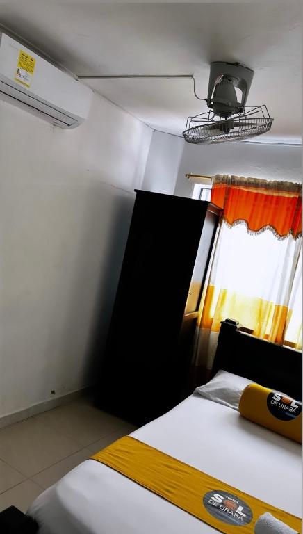 Postel nebo postele na pokoji v ubytování Hotel sol de uraba