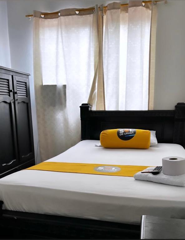 Postel nebo postele na pokoji v ubytování Hotel sol de uraba