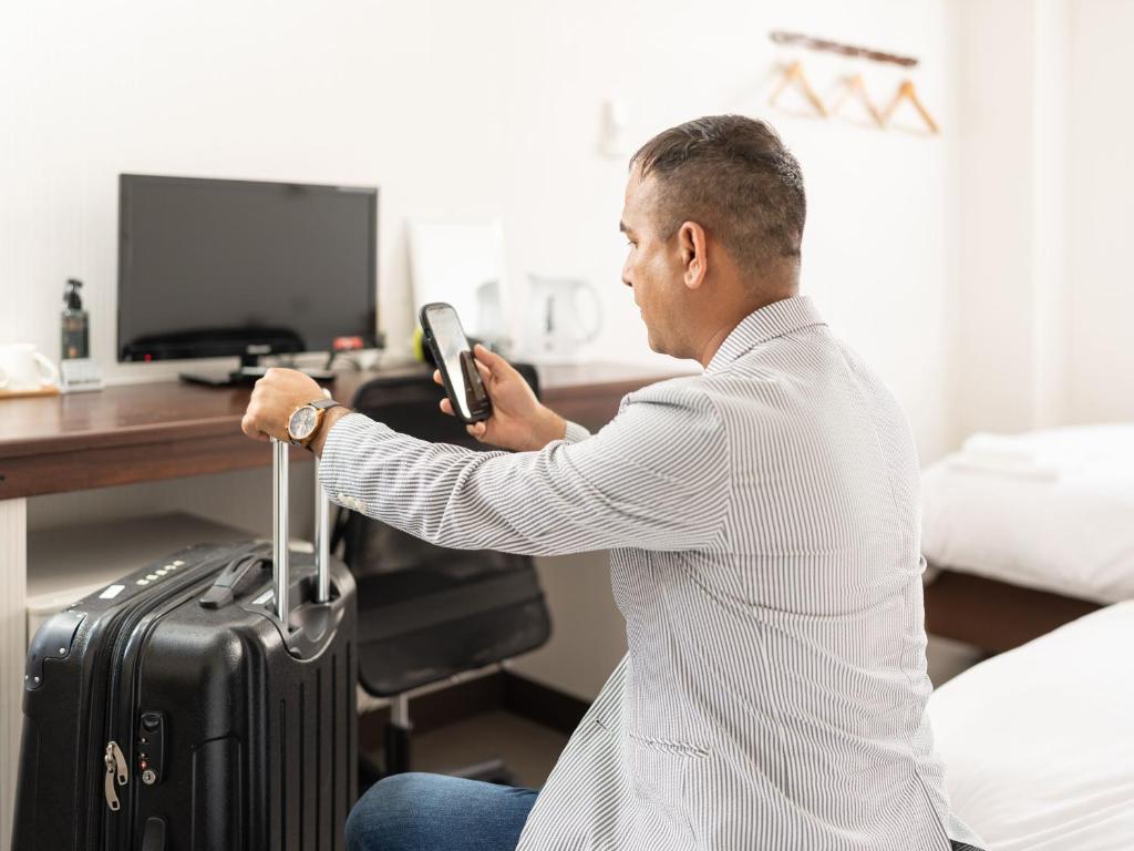 TV a/nebo společenská místnost v ubytování Travel Inn Kofu