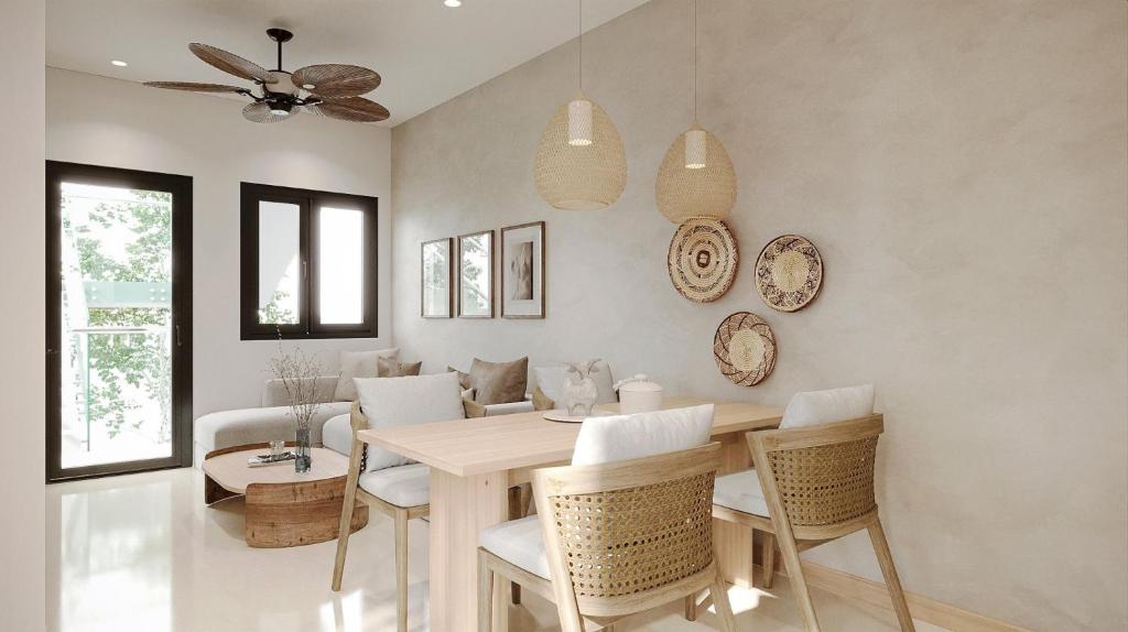 a dining room with a table and chairs at Azalea Apartment in Hanoi